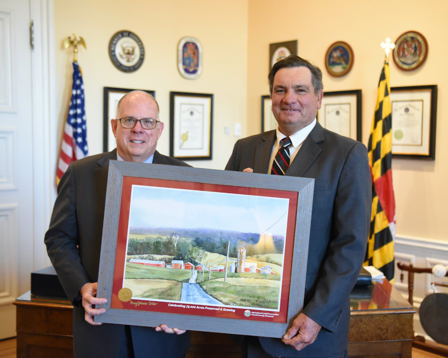 Secy Bartenfelder Presents Framed 75K Poster to Governor (2021-Nov-9)